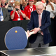 Illustration for article titled Heres Warren Buffett Swinging A Ridiculous, Supersize Ping-Pong Paddle